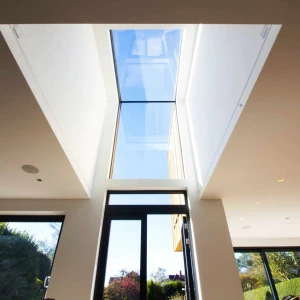 Eaves skylight above doorway letting natural light shine in