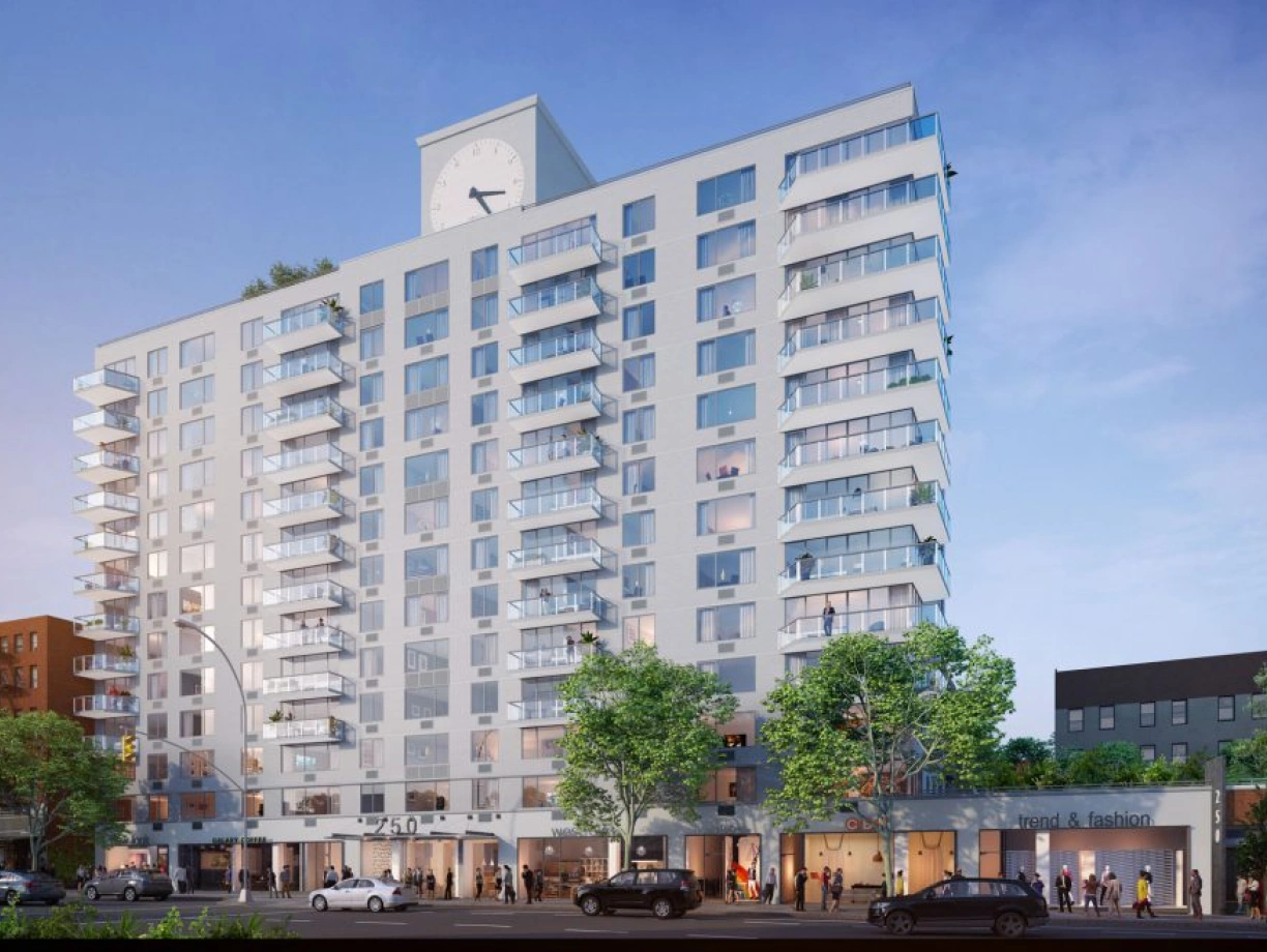 A modern multi-story residential building featuring a large clock on the facade. The design includes balconies on each floor and commercial spaces at the ground level. Surrounding trees and the street add to the urban atmosphere.